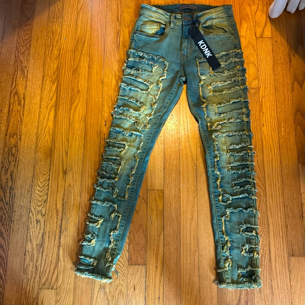 KDNK ripped up bleach blue colored jeans                   (11 4 14 11) SIZE: 28